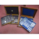 A Decorative Set of Twelve Fruit Knives and Forks, contained in fitted wooden case with lift out