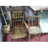 A XIX Century Ash-Elm Comb Back Chair, with a rectangular top rail, scroll arms, on turned legs,