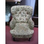 A XX Century Armchair, in floral tapestry fabric, on cabriole legs, pad feet.