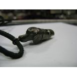 A Hallmarked Silver Hound's Head Whistle, with applied suspension loop.
