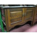 An Early XX Century Walnut Wash Stand, rectangular top above a pair of panelled cupboard doors