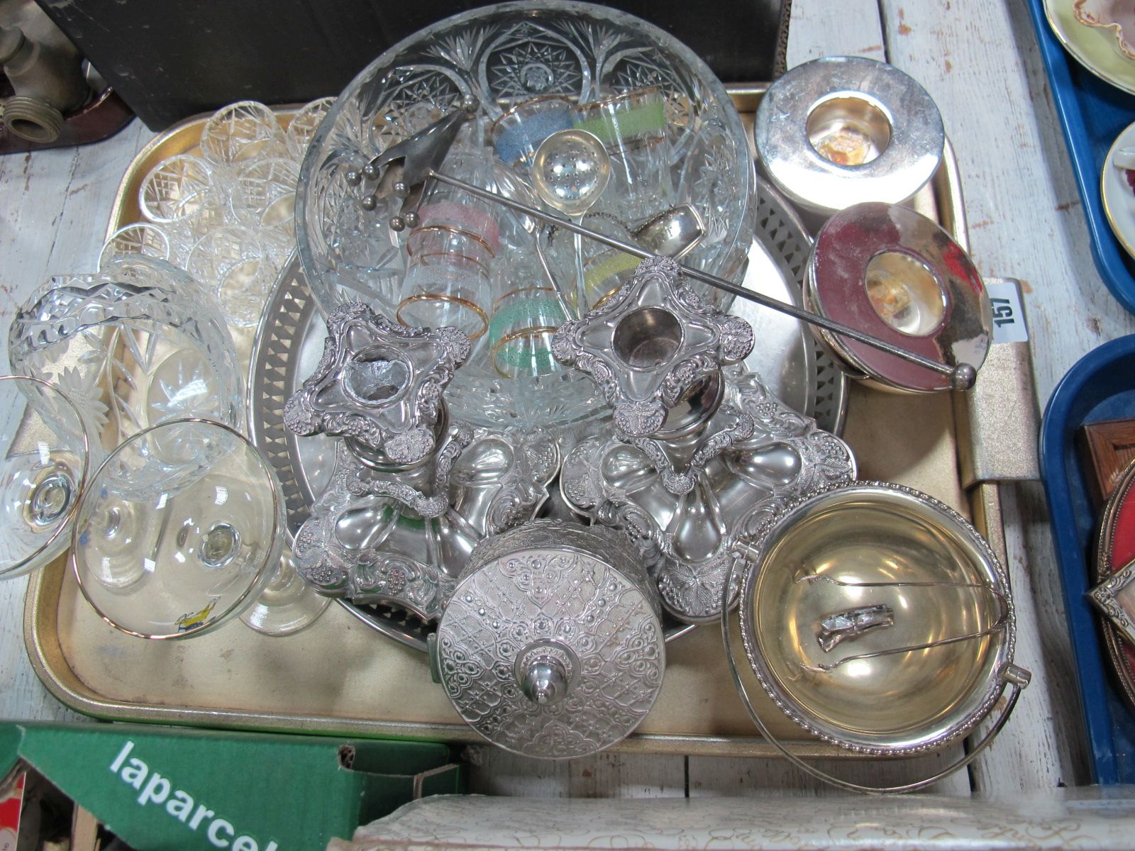 Six Glass Napkin Rings, cut glass fruit bowl, plated candlesticks, silver sugar tongs etc:- One Tray