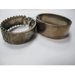 A Wide Hallmarked Silver Bangle, leaf scroll engraved, hinged to snap clasp; together with