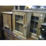 An Oak Coal Bin, with a hinged lid, front panel with a carved galleon, together with two pine wall