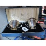 A Hallmarked Silver Jug and Twin Handled Sugar Bowl, each of panelled design, on spreading base,