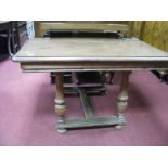 A Oak Continental Dining Table, circa 1900, the top 108.5 x 98.5cm, having moulded edge, supported