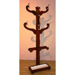 A Victorian oak 'Tree' hallstand, with later ceramic and gilt metal pegs,
