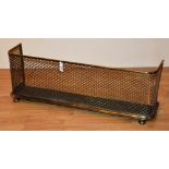 A brass and wire mesh fire fender,