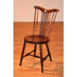 An antique child's spindle back chair, with solid seat,