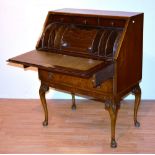 A lady's walnut writing bureau circa 1940's-50's, with drop flap above two drawers,