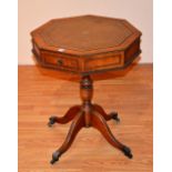 A reproduction octagonal library type octagonal occasional table, with tooled leather inset to top,