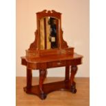 A Victorian mahogany dressing table, the swing mirror raised above single drawer,