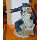 A large Nao by Lladro figure group, in the form of a sailor and child,