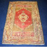 A Persian Hamadan rug, decorated with central medallion and geometric border,