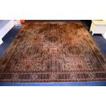 A Wilton style carpet, decorated with Persian style geometric motifs and medallions, on green,