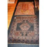 A Persian rug, with geometric decoration on pink, yellow, blue and white ground, (a/f),