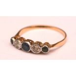 An Edwardian yellow metal five stone sapphire and diamond ring,