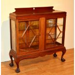 A mahogany display cabinet, with two glazed astragal doors,