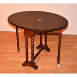 A late Victorian Sutherland table circa 1900, raised on bobbin twist supports, with ceramic castors,