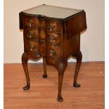An early 20th century figured walnut serpentine chest of drawers, of small proportions,