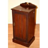 A late Victorian mahogany bedside locker, with panelled door,