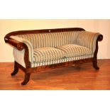 An early 20th century Biedermier mahogany inlaid framed settee, with scroll arm rests,