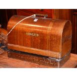 A vintage portable Singer sewing machine, in fitted case,