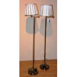 A pair of modern metal floor lamps with shades, angle poise, converted to electricity,