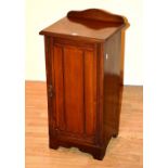 A late Victorian mahogany bedside locker, with panelled door,