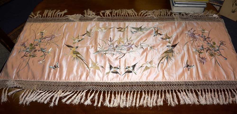 An Oriental embroidered silk, decorated with birds, butterflies and flowers,