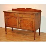 An oak sideboard circa 1940's, with two small drawers above two panelled doors,