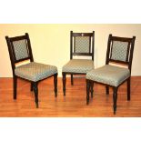 Three matching mahogany dining chairs, early 20th century, with later upholstered seats,