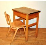 A vintage school desk with chair,