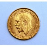 A 1913 George V gold sovereign,