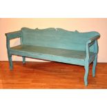 A green painted wooden bench/hall seat, with shaped back and supports,