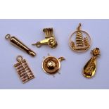 Six loose 14ct gold charms, each stamped 585, 7.