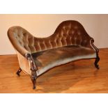 A Victorian scroll end mahogany settee, upholstered in gold velour,