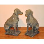 A pair of garden stoneware seated dogs,