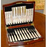 A set of 12 silver fruit knives and forks, hallmarks for Sheffield 1928,