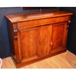 A Victorian mahogany chiffonier cupboard base, with two panelled doors, raised on plinth base,