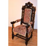 An early 20th century stained oak throne armchair,