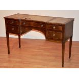 A reproduction desk, with three tooled leather panels to top,