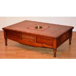 A contemporary cherry wood coffee table, with cellerette to centre, with envelope compartments,