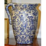 An antique overprinted stoneware jug in the Persian style,