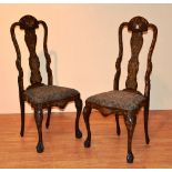 A pair of 19th century Duch Marquetry inlaid chairs, decorated with floral panels,