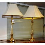 A pair of cut glass and brass mounted table lamps with shades, converted to electricity,