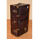 A Vintage gentleman's travel wardrobe/trunk, with label for Finnigans, enclosing fitted coat racks,