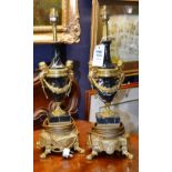 A pair of reproduction ormolu type and marble effect table lamps,