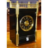 A late Victorian black slate mantel clock by Mathieson & co,