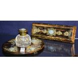 A Victorian coromandel desk stand, with integral glass inkwell, decorated with brass mounts,